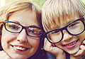 Woman and young boy in glasses